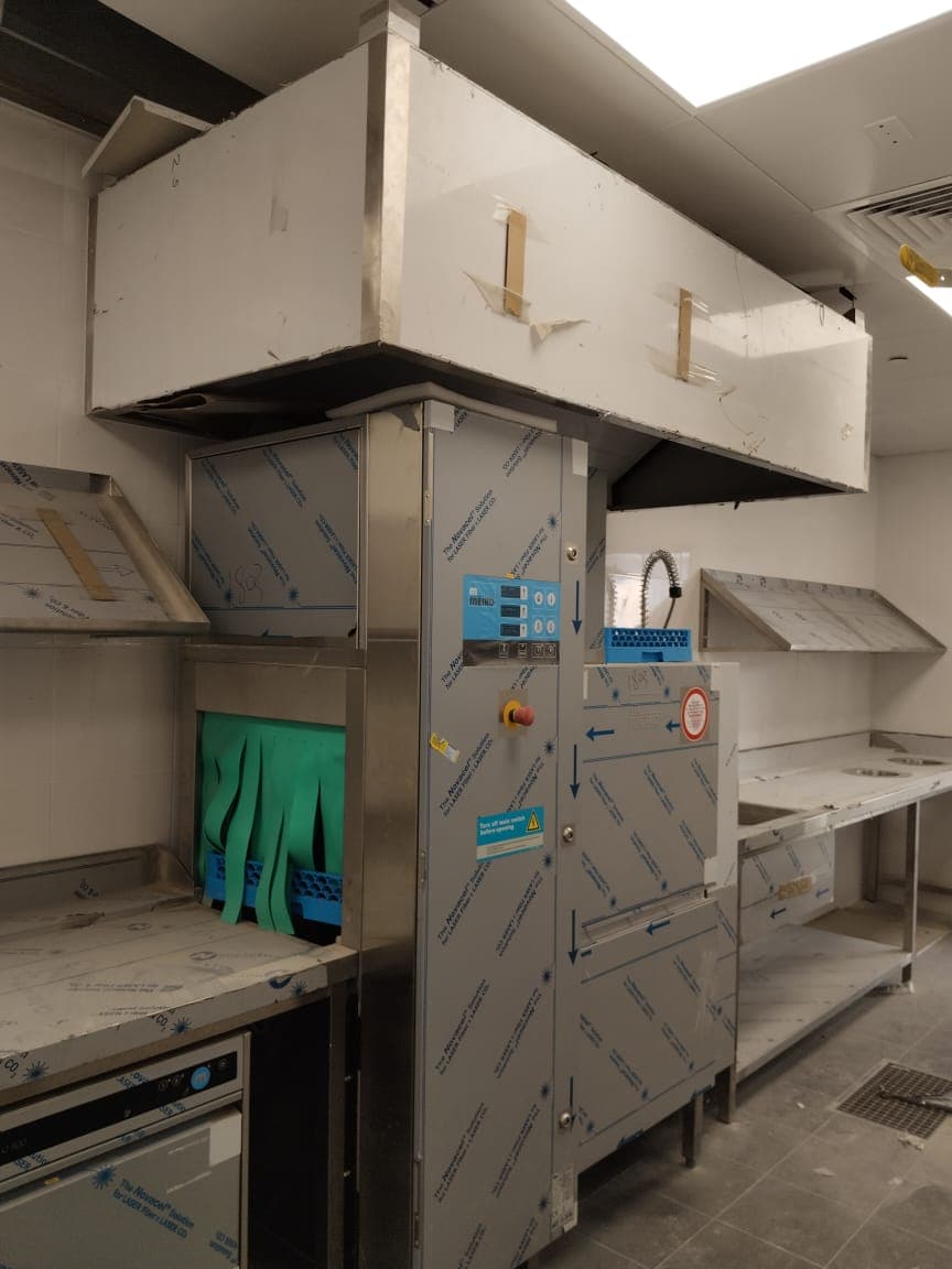 Pass-through warewasher with extract canopy and stainless steel dish tables, Dubai